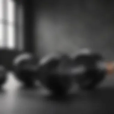 Black iron dumbbells on a sleek modern background