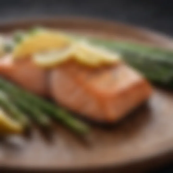 Grilled salmon fillet with lemon wedges and asparagus spears