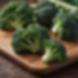 Broccoli florets on a wooden cutting board