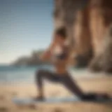 Fitness woman doing yoga pose by the beach