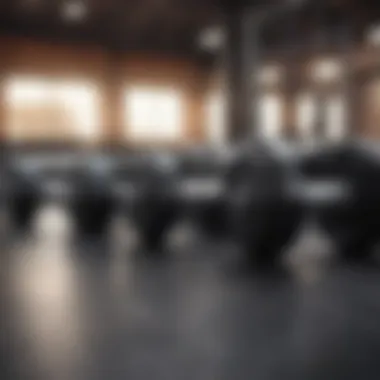 Dumbbells on gym floor with motivational quote