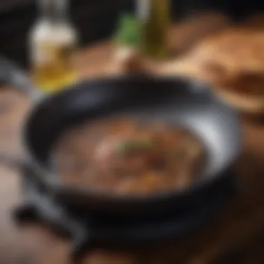 A cast iron skillet greased with oil, ready for seasoning after cleaning.