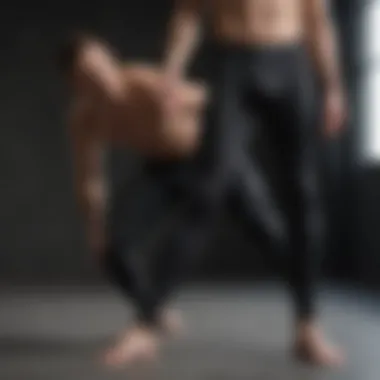 Male yogi practicing poses in stylish leggings