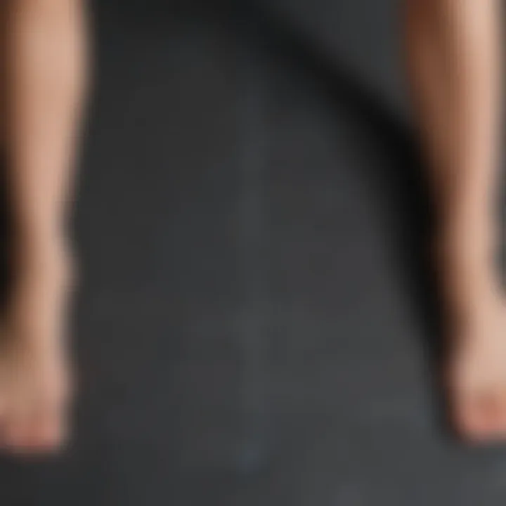 An overhead view of a yoga mat for leg stretching routine