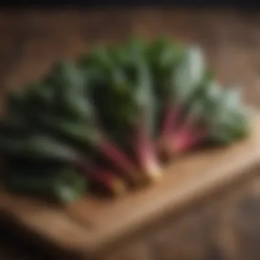 Colorful swiss chard bunches on a wooden cutting board