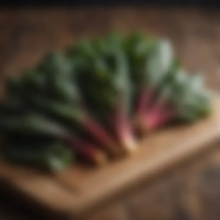 Colorful swiss chard bunches on a wooden cutting board