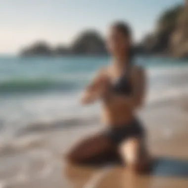 Woman doing yoga by the ocean
